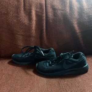 Black Nikes, size 12c good condition.